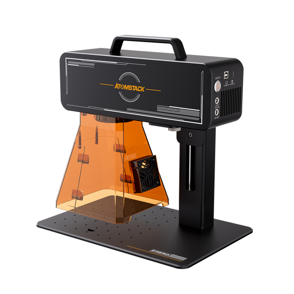 High resolution image showing a side view of the Atomstack M4 Pro laser engraver. The unit has an acrylic shield, exhaust fan and the engraving area and power socket are clearly visible.
